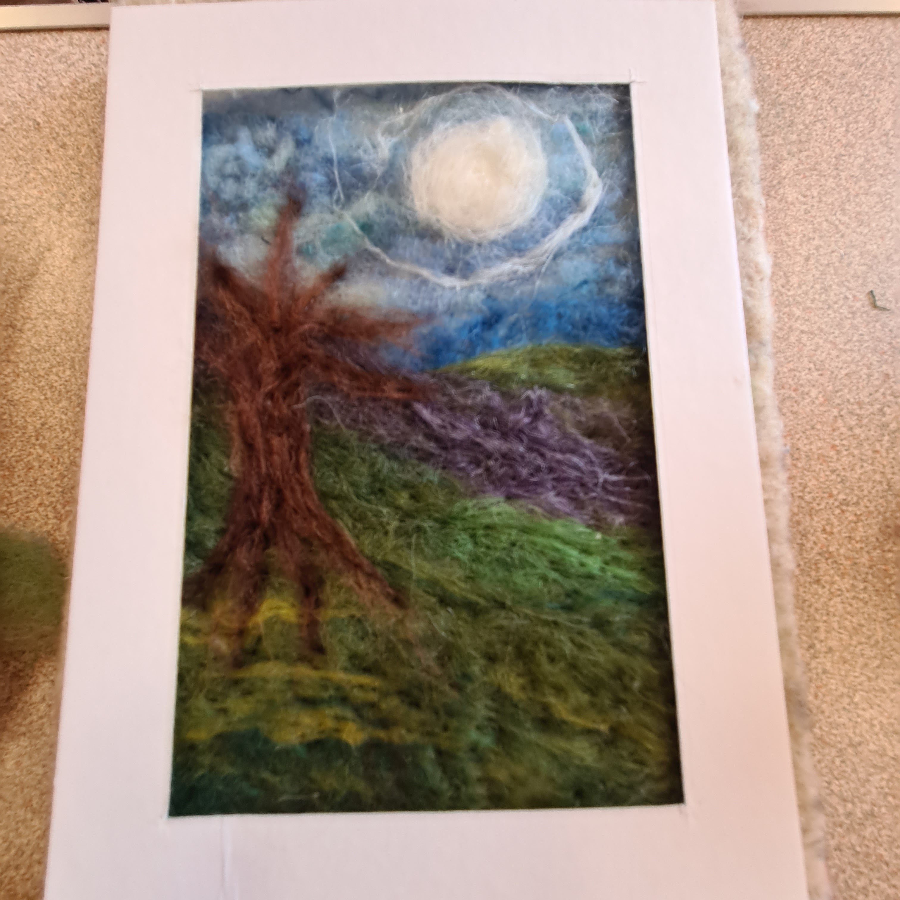 Create a needlefelted landscape