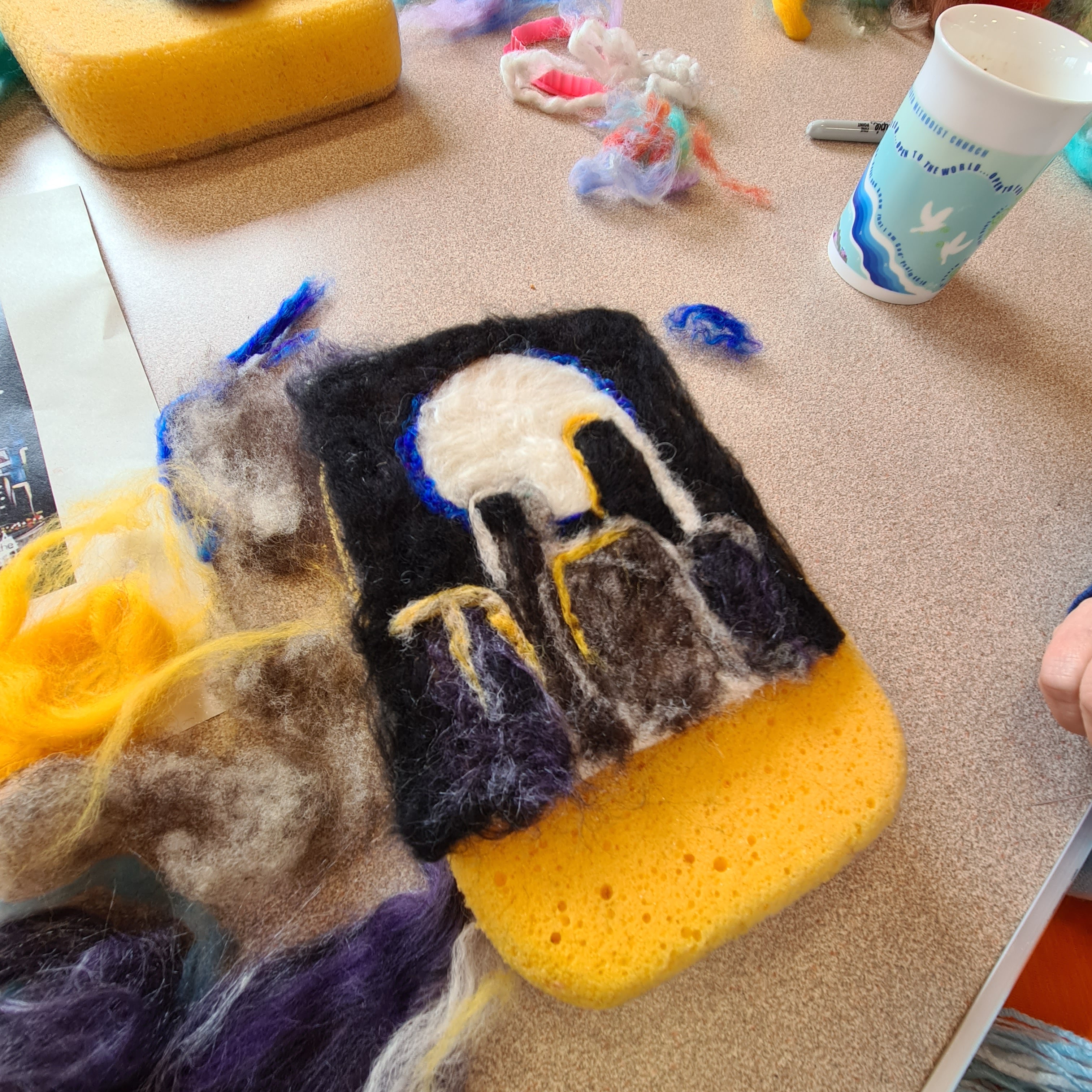 Create a needlefelted landscape