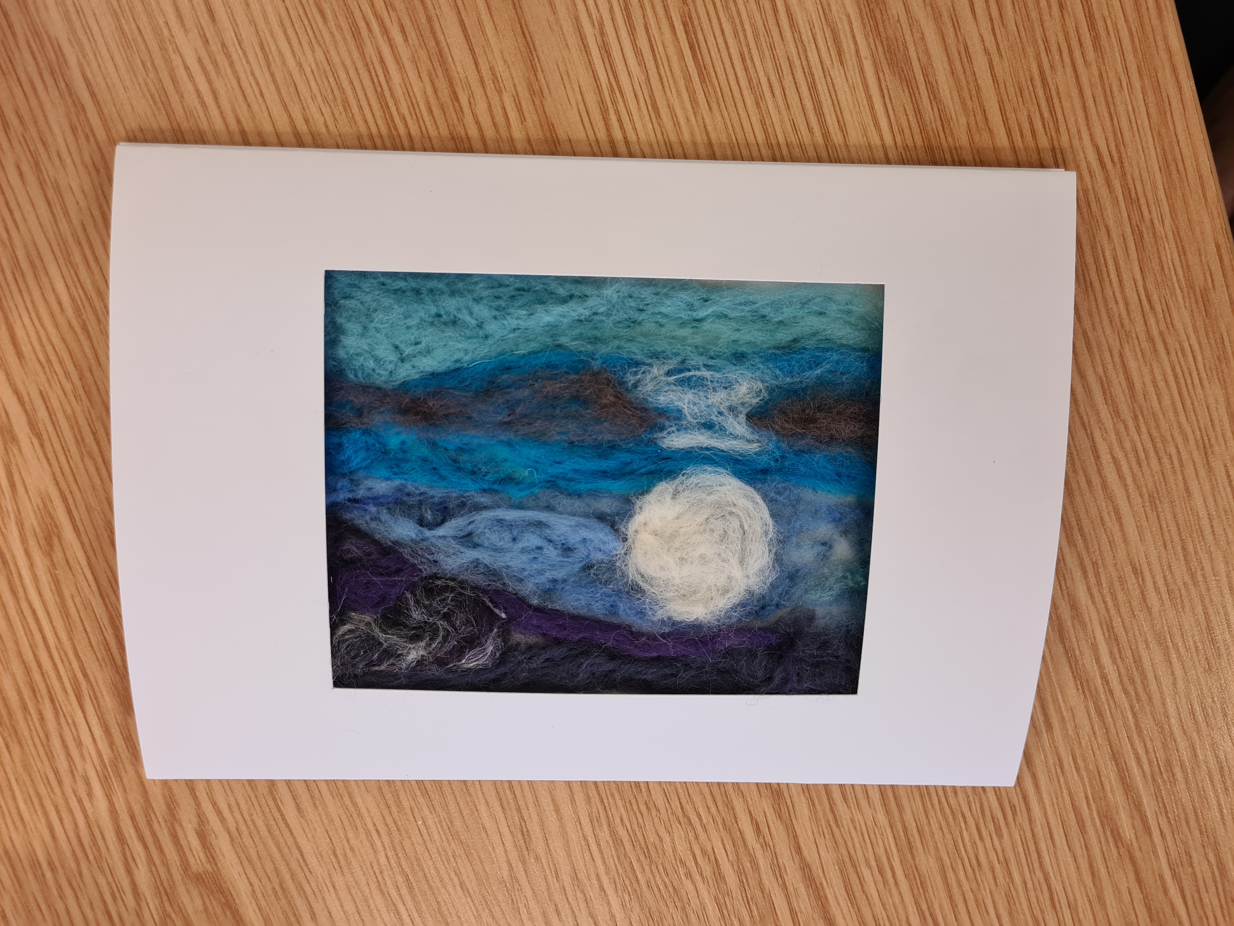 Create a needlefelted landscape