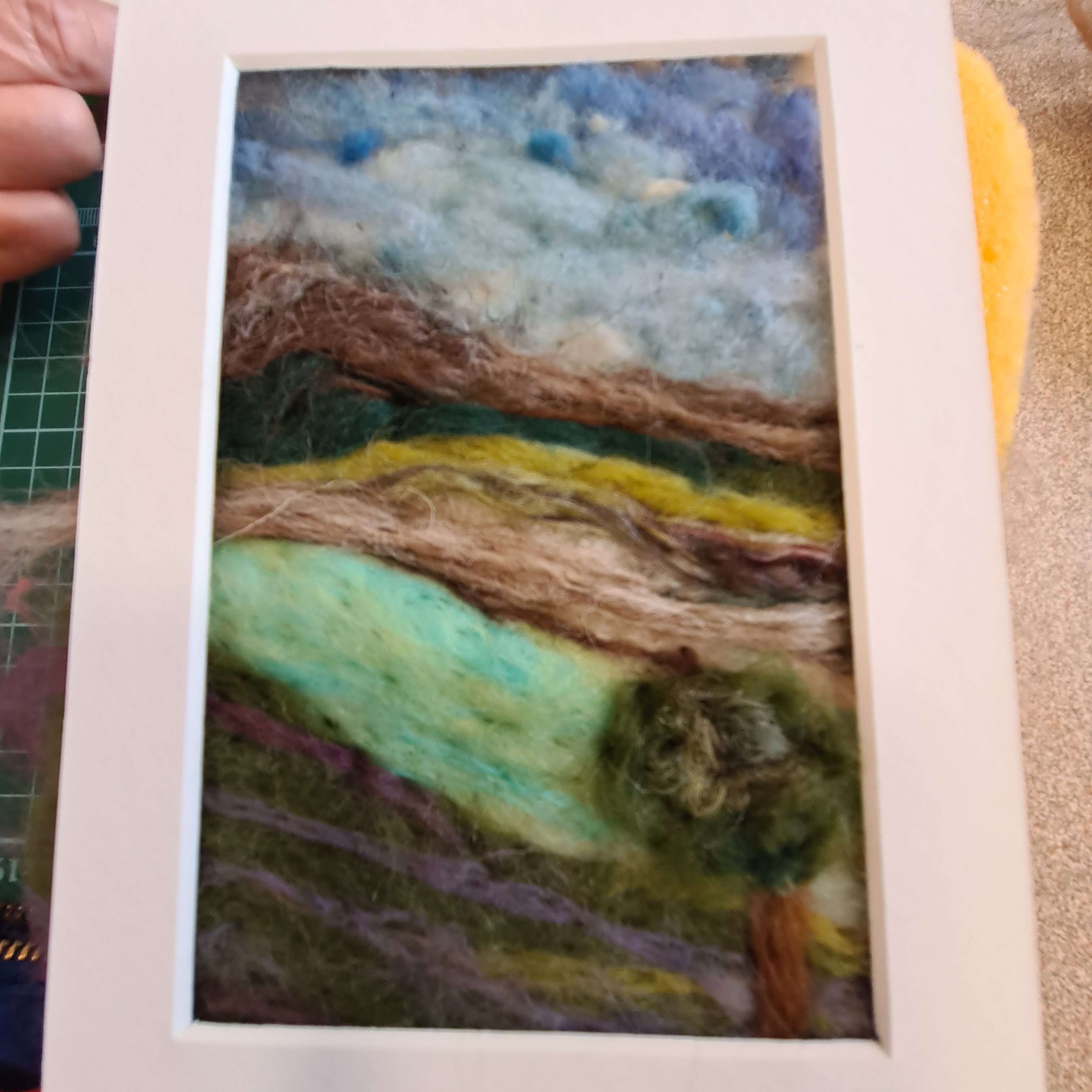 Create a needlefelted landscape