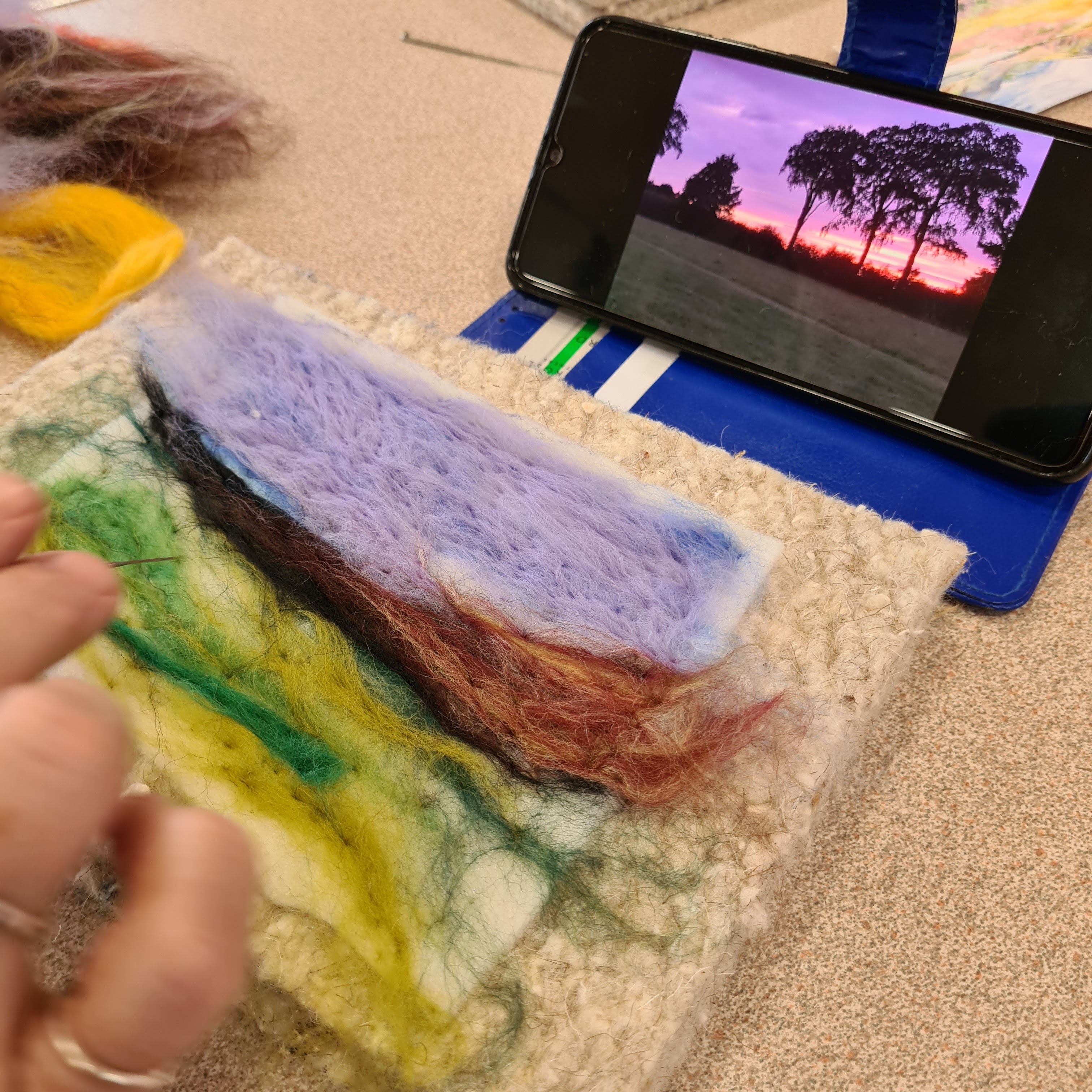 Create a needlefelted landscape