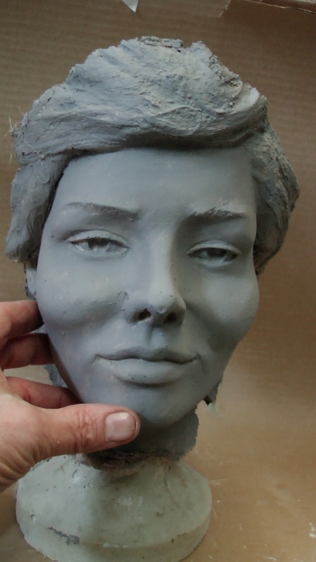 Sculpt a human face in clay